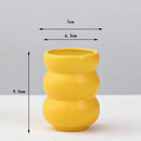 Matte yellow porcelain flower vase for living room home decor by Decorbites