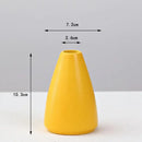 Matte yellow porcelain flower vase for living room home decor by Decorbites