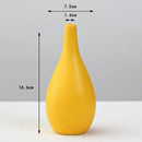 Matte yellow porcelain flower vase for living room home decor by Decorbites