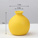 Matte yellow porcelain flower vase for living room home decor by Decorbites