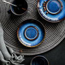 Deep blue glossy ceramic espresso coffee cup saucer set dining room by Decorbites