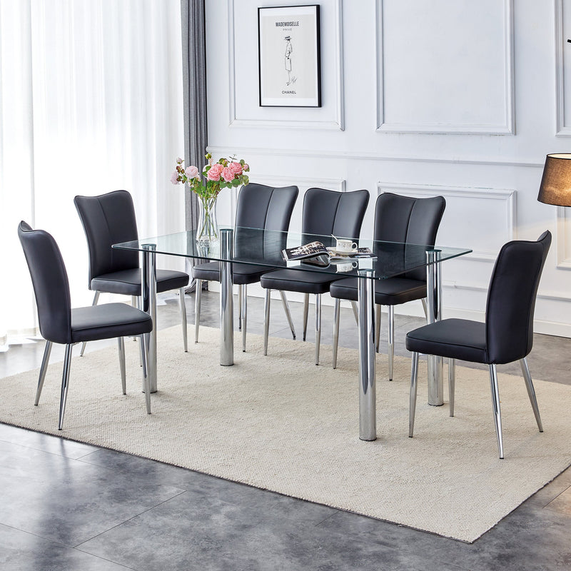 A modern minimalist style glass dining table. Transparent tempered glass tabletop with a thickness of 0.3 feet and silver metal legs. Suitable for restaurants and living rooms. 63 "x 35.4" x 30"