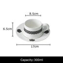 Elegant black and white floral porcelain cup and saucer set dining room by Decorbites