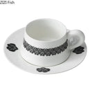 Elegant black and white floral porcelain cup and saucer set dining room by Decorbites