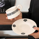 Elegant black and white floral porcelain cup and saucer set dining room by Decorbites
