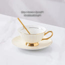 Elegant gold porcelain tea set dining room rack with bird figurine by Decorbites