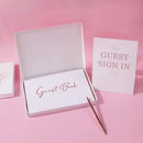 Elegant white guest book with bronzing detail – wedding reception by Decorbites