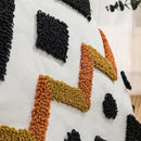 Ethnic style black & orange geometric cushion cover living room tassel by Decorbites