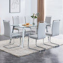 A modern minimalist rectangular glass dining table with tempered glass tabletop and silver metal legs, suitable for kitchens, restaurants, and living rooms,63"x35.4"x30"