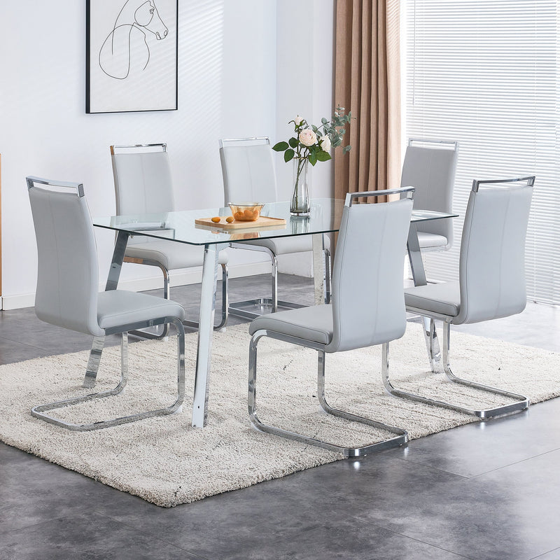 A modern minimalist rectangular glass dining table with tempered glass tabletop and silver metal legs, suitable for kitchens, restaurants, and living rooms,63"x35.4"x30"