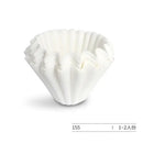 Fluted white disposable paper coffee filters kitchen basket style by Decorbites