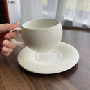 Frosted white textured ceramic cup and saucer set dining room by Decorbites