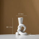 Geometric black & white ceramic knot candle stand living room decor by Decorbites