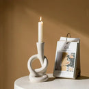 Geometric black & white ceramic knot candle stand living room decor by Decorbites