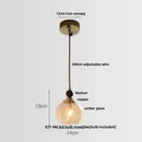 Geometric brass and clear glass led pendant light dining room by Decorbites