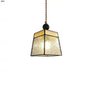 Geometric brass and clear glass led pendant light dining room by Decorbites