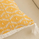 Geometric tufted yellow cushion cover with crochet tassels living room by Decorbites
