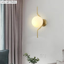 GobekUsa Globe White Glass Wall Mount Sconce Light with Elegant Gold Arm and Base