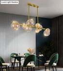 GobekUsa Gold Mid-Century Pendant Light - Stylish Spherical Clear Glass Ceiling Fixture for Dining Table
