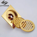 Gold square bathroom shower drain with interchangeable grates by Decorbites