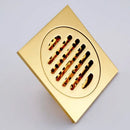 Gold square bathroom shower drain with interchangeable grates by Decorbites