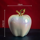 Golden ceramic apple sculpture living room table decor by Decorbites