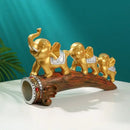 Golden elephant resin ornament living room figurine on log base by Decorbites