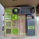 Green and black vegetable slicer cutter grater with basket kitchen by Decorbites