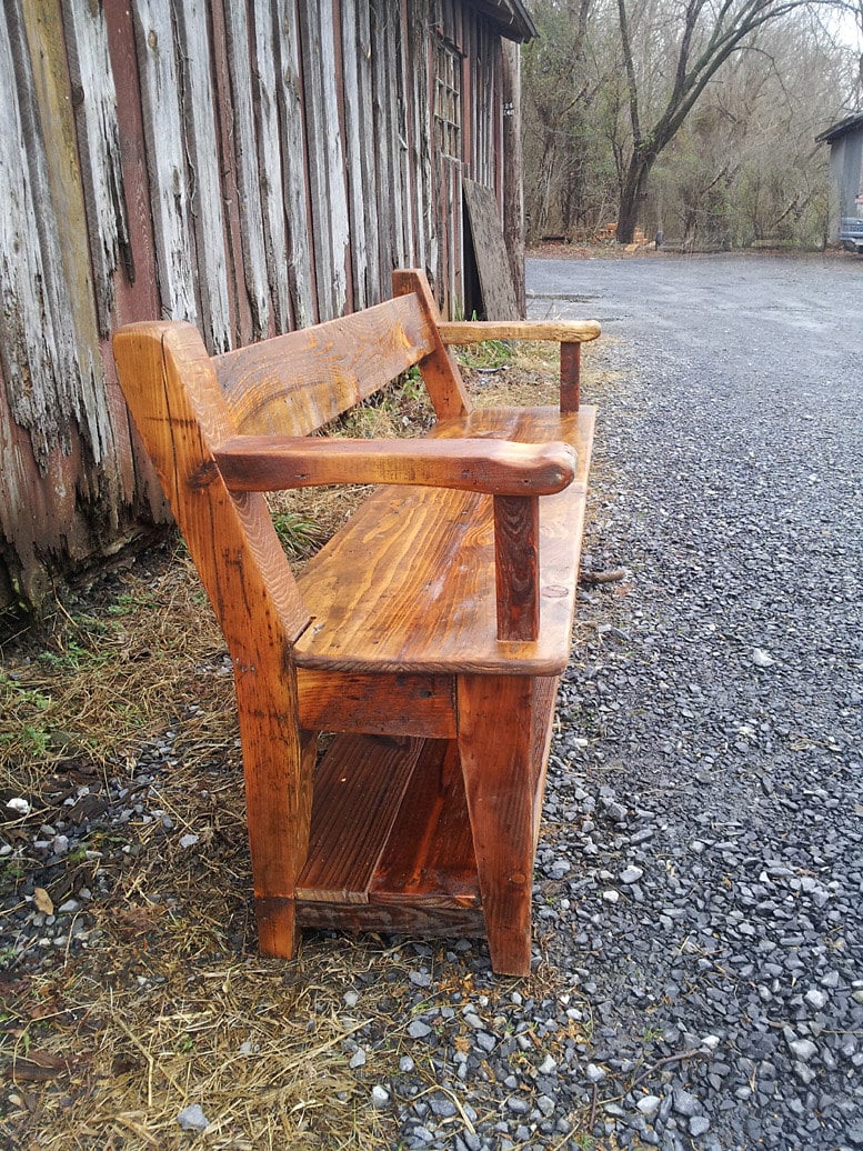 Wood dining bench with back and armrests. Reclaimed wood bench