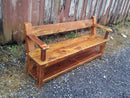 Wood dining bench with back and armrests. Reclaimed wood bench