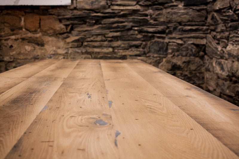 Trestle dining table made of reclaimed solid wood. Modern farmhouse wooden table with antique design