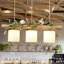 GobekUsa Industrial 3-Light Hanging Pendant for Coffee Shop with Milky Glass Cylinder, Wooden Stick, and Bird Accent