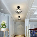 Industrial black geometric cage flush mount ceiling light bedroom by Decorbites