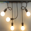 Industrial black gooseneck track lighting – clothing store fixture by Decorbites