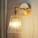 GobekUsa Clear Textured Glass Wall Sconce with Brass Accents for Industrial Dining Room Lighting