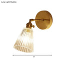 GobekUsa Clear Textured Glass Wall Sconce with Brass Accents for Industrial Dining Room Lighting