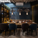 GobekUsa Metallic Island Pendant Light with Industrial Bare Bulb Design - 3 Lights & Wheel Decor in Bronze