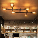 GobekUsa Industrial Intersecting Piping Ceiling Light - Iron Semi Flush Mounted with Cage Guard, Brass Finish (4/5/8 Heads)