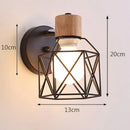 Industrial iron cage wall light bedroom black metal sconce by Decorbites
