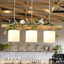 GobekUsa Industrial 3-Light Hanging Pendant for Coffee Shop with Milky Glass Cylinder, Wooden Stick, and Bird Accent