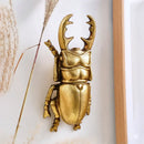 Intricate golden beetle resin handicrafts living room wall decor by Decorbites
