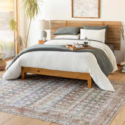 Rust Maligaya Distressed Washable Area Rug, installed in a room