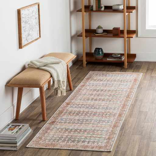 Rust Maligaya Distressed Washable Area Rug, installed in a room