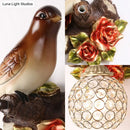 GobekUsa Lodge Style Resin Bird Wall Sconce Light with Crystal Global Shade