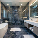 Modern bathroom with marble floor and walls, featuring a freestanding bathtub and vanity area. Luna Sky Gray Marble Polished Wall and Floor Tile 12"x24"