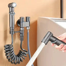 Matte black bidet spray set with coiled hose for bathroom by Decorbites