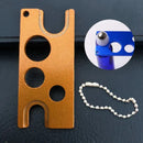 Metallic multi color essential oils opener tool for kitchen storage by Decorbites