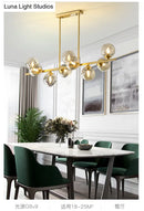 GobekUsa Mid-Century Modern Gold Metal Pendant with Spherical Amber Glass - Island Ceiling Light for Dining Table