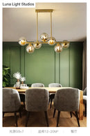 GobekUsa Mid-Century Modern Gold Metal Pendant with Spherical Amber Glass - Island Ceiling Light for Dining Table