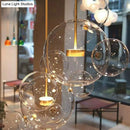 GobekUsa Minimal Brass Bubble Pendant Light with 5 Clear Glass Heads